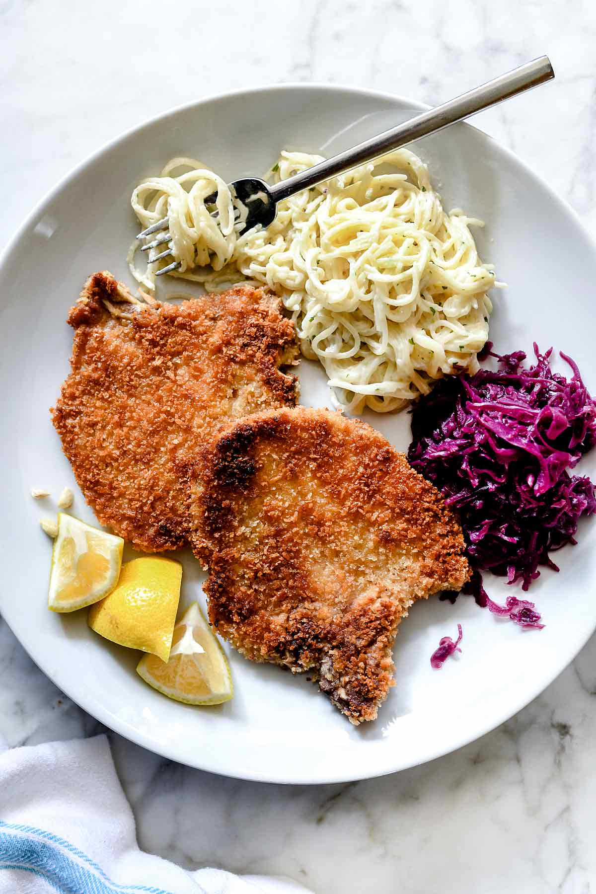 Easy German Schnitzel | foodiecrush.com #schnitzel #german #pork #porkchops #porkchops